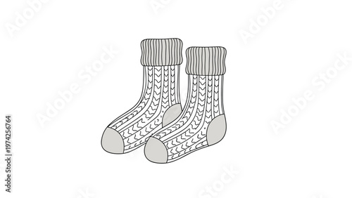 Pair of cozy grey and white knitted wool socks with a traditional cable pattern isolated on a plain white background.