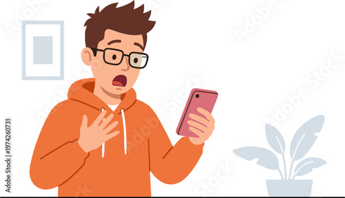 Man in orange hoodie looks shocked while holding smartphone indoors with plant