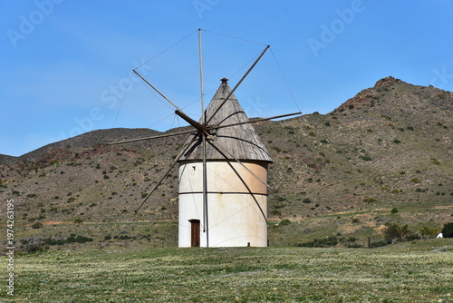 old windmill in landscape of nature reserve Cabo de Gata,Spain