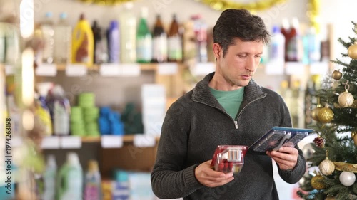 On X mas Eve, man choose and get acquainted with assortment, choose razor for allergy sufferer and delicate skin. Customer studies properties of product, checks expiration date