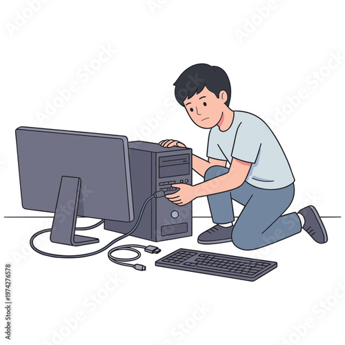A man kneels beside a computer repairing the tower with a monitor and keyboard nearby.