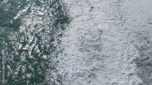 Aerial view of Waves on the beach and rock