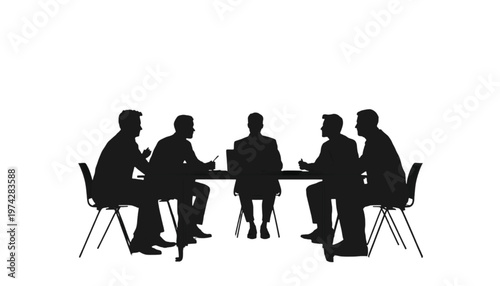 Team members engage in a focused business discussion around a modern conference table during a productive.