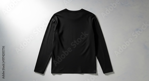 Sleek Black Long-Sleeved Performance Shirt for Athletic Training and Everyday Comfort, Perfect for Layering and Active Lifestyles, Flat Lay View
