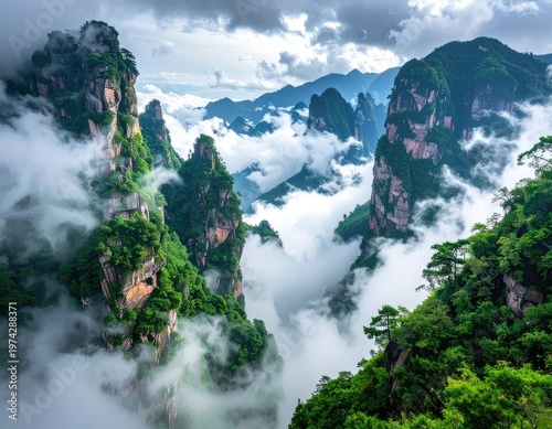 A breathtaking panoramic view showcases towering, verdant karst mountains emerging from a sea of swirling clouds, creating a dramatic and ethereal landscape.
