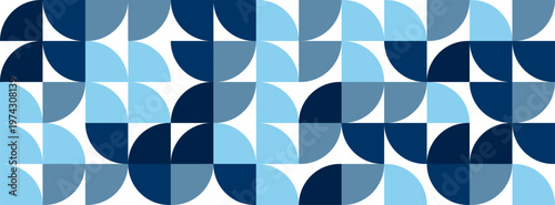 Shapes in blue tones are arranged in a repeated pattern creating a visual display with a variety of curves and lines