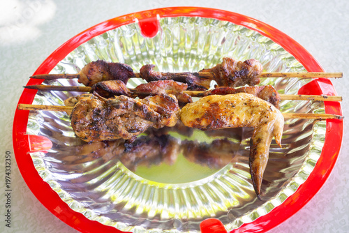 Filipino barbecue skewers made with grilled pork and chicken. typical Filipino food or picnic meal in the Philippines.