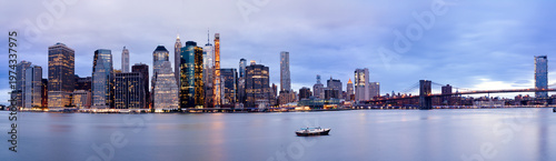 Panoramic View of Lower Manhattan Skyline and Brooklyn Bridge at Blue Hour, New York City.