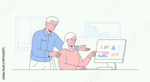 Elderly couple learning to use computer technology together.