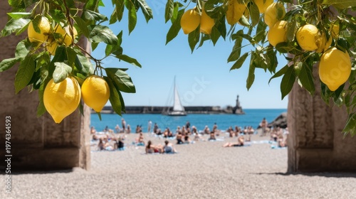 People relax on the beach under lemon trees next to clear water and coastal buildings on a sunny day along the shore