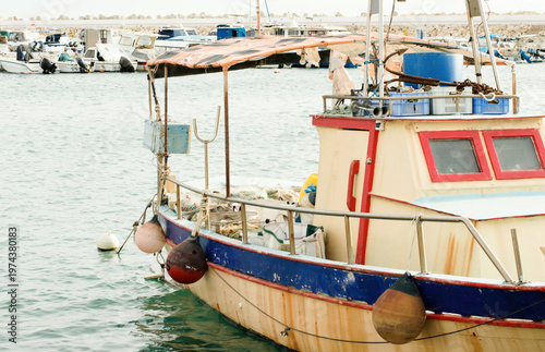 A fishing boat in the port of a fishing village