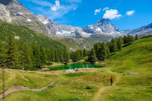 View of the mountain Blue Lake, mountain ridge and Matterhorn peak in Aosta Valley, Italy.