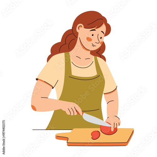 Smiling woman in apron slices a tomato on a board. A cozy home cooking scene featuring healthy food