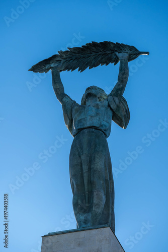 Liberty Statue at Citadella in Budapest, Hungary, rising against a clear blue sky and symbolizing freedom at a newly reopened historic landmark.