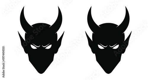 Two devil heads with horns and glowing eyes on transparent background silhouette