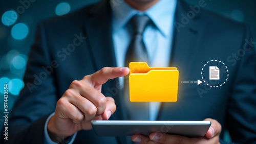 Businessman hand holding digital tablet with virtual yellow folder and document transfer icon, online data storage management technology concept.