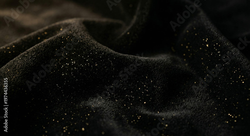 Black velvet texture, soft matte fabric with subtle gold shimmer, low light mood, luxury premium background.