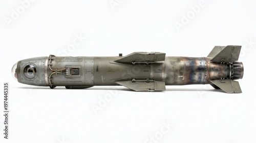 Detailed studio shot of a guided bomb or missile with fins and optical head.