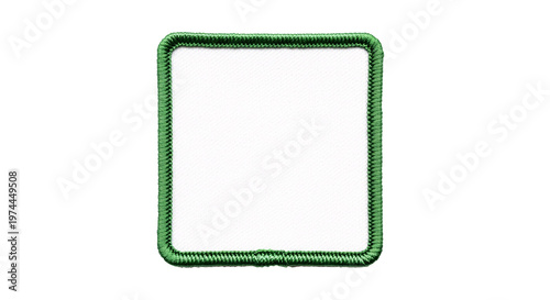 White square patch with green border on checkered background.