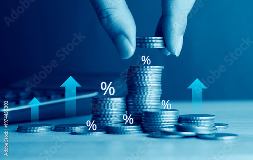Tableau sur toile Investor stacking coins with percentage icons and upward arrows, concept of comp