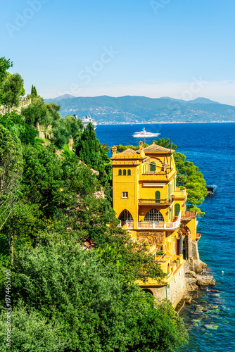 amazing coastal landscape of summer season hotel resort with green trees, sea beach and amazing sunset or sunrise cloudy sky on background