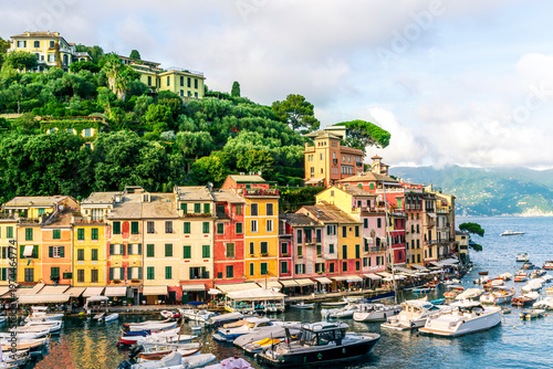 beautiful landscape of luxury resort Portofino in Luguria , Italy.  Sea coast of elite italian resort during sunset or sunrise. Beautiful bay with buildings and green mountain forest.