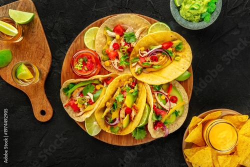 Wallpaper Mural Mexican food. Tacos, tequila, nachos, guacamole, overhead flat lay shot on a black table Torontodigital.ca