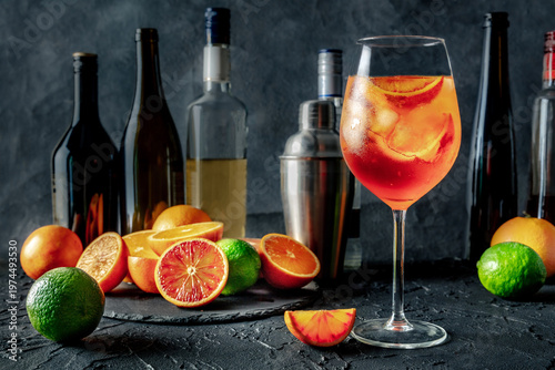 Wallpaper Mural Aperol Spritz, cocktail with oranges and sparkling wine, in a bar, with citrus fruits and bottles of alcohol, side view Torontodigital.ca