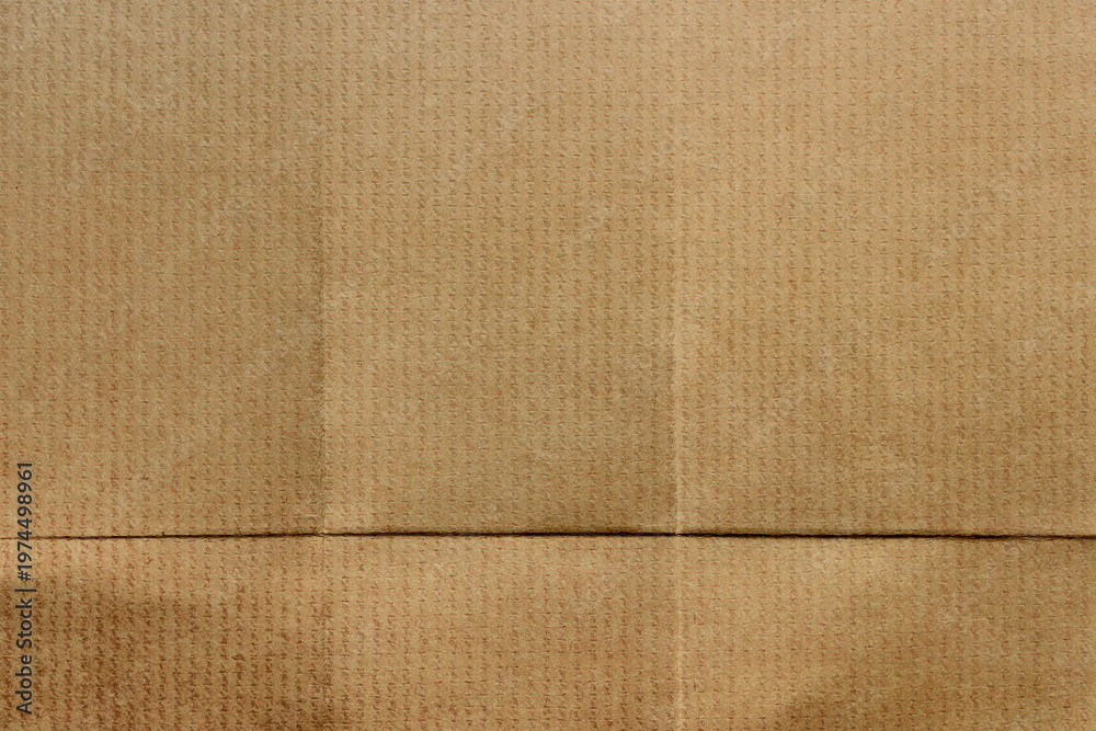 Fototapeta premium Textured brown cardboard background with copy space