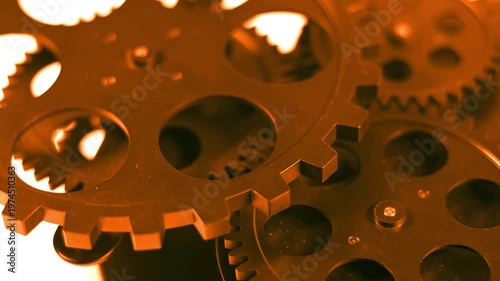 High-quality footage of warm golden-toned rotating gears. Ideal for business success, financial growth, and prestige engineering.