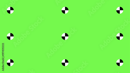Professional greenscreen setup with tracking points and motion markers for seamless chroma key compositing in cinema and television post-production