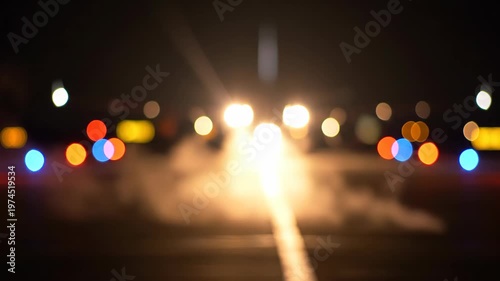 Abstract Night City Lights and Car Headlights Bokeh Effect.