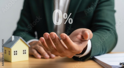 Asian male hand presenting zero percent symbol in bright office, financial offer and mortgage relief concept