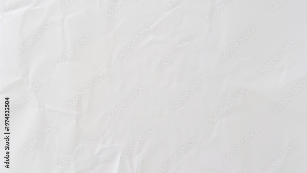 Fototapeta premium Crumpled white background with a textured, wrinkled style. The white background adds a soft, minimalistic touch. Gray desktop wallpaper with copy space.