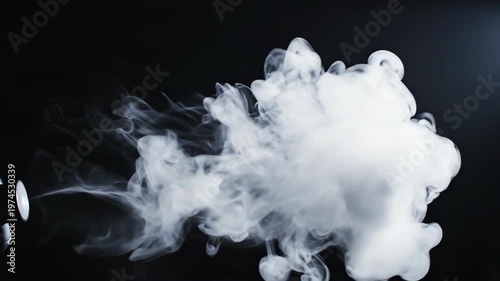 Dynamic White Smoke Cloud Expanding Against a Dark Background.