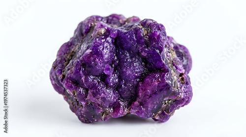 Macro shot of a striking violet geological specimen with unique rough texture