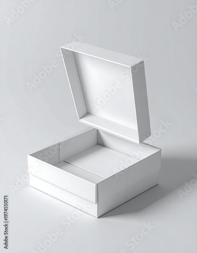 A pristine white square box, its lid partially open, sits against a neutral gray backdrop, softly lit for a clean, minimalist aesthetic