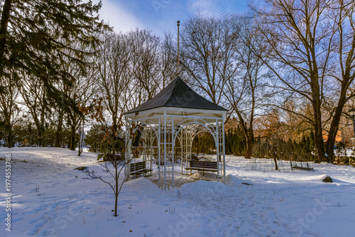 Gazebo at Shakespearean Gardens park at Stratford, near the Avon River, covered in snow  in the winter.