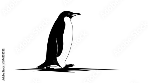 Penguin standing on ice surface.