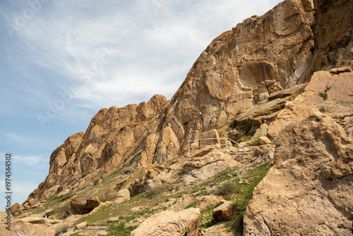 Majestic red rock formations and Buddhist petroglyphs site at Tamgaly Tas. Ili River landscape