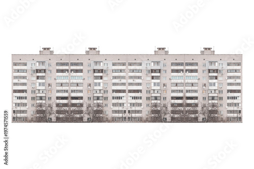 Nine-storey gray brick apartment building facade is isolated