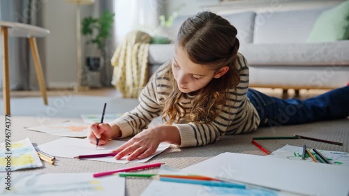 Closeup imaginative girl drawing at home floor closeup. Child crafting image