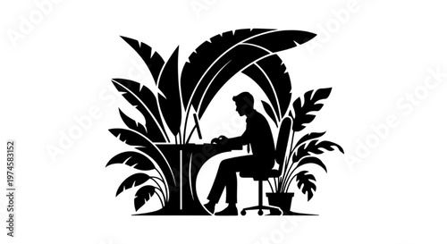 Man working at desk surrounded by lush tropical plants, a modern workspace concept