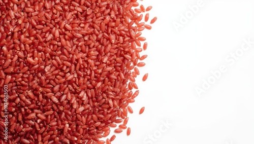 Close-up of red rice on a white background.
