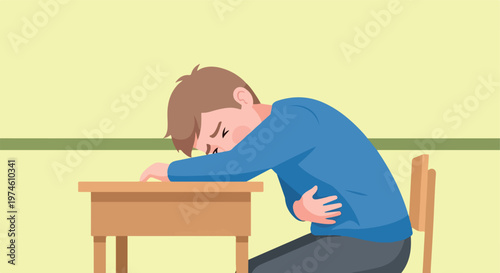 A young boy sitting at a desk holds his stomach in pain with a distressed face