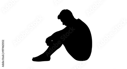 Silhouette of a person sitting alone, head down, conveying sadness and isolation.