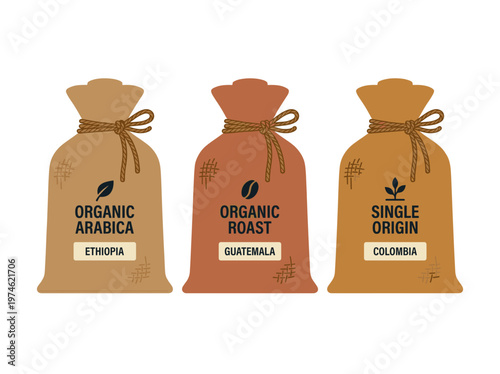 Three sacks of organic coffee beans, each marked with its origin