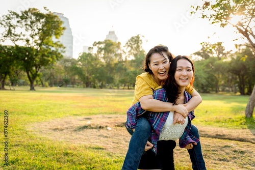 Принти на полотні Joyful piggyback ride outdoors photo