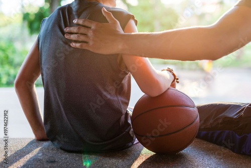 Schilderij op canvas Supportive basketball friendship outdoors photo