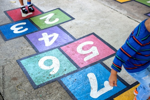 Принти на полотні Colorful hopscotch game outdoors.